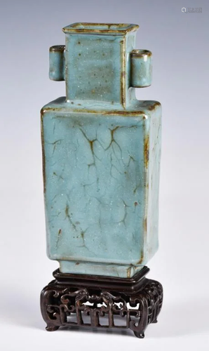 A Small Blue-Glazed Vase With Stand