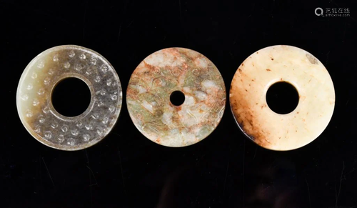 A Group of Three Jade Bi Discs