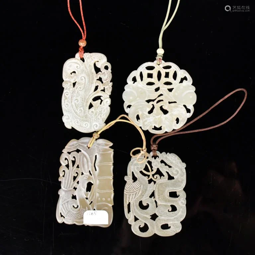 A Group of Four White Jade Pendants