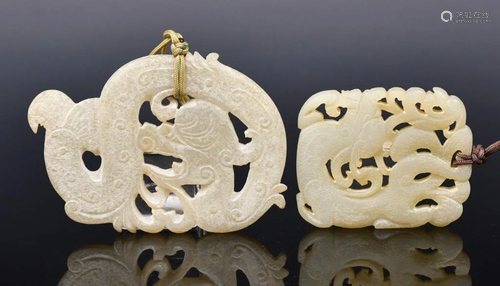 A Pair of White Jade Dragon Pendants