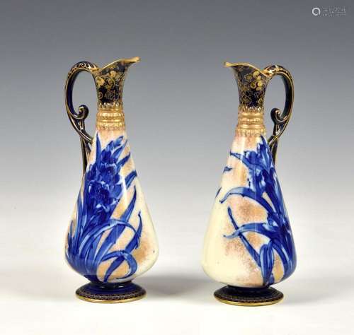 A pair of Royal Doulton Burslem ewer vases decorated with bl...