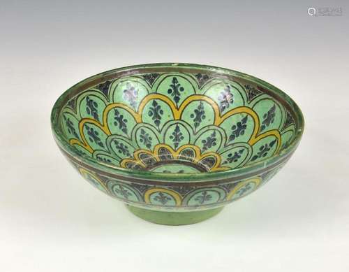 A Iznik pottery bowl probably 19th century, green and yellow...