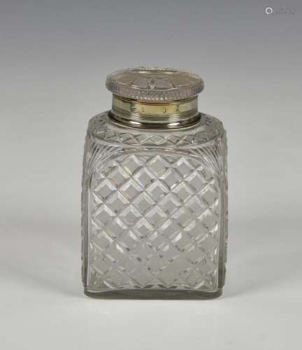 A 19th century cut glass square tea caddy jar with silver co...