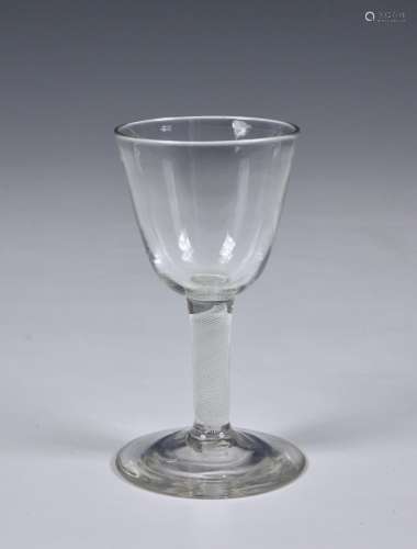 A Georgian air twist wine glass circa 1750, the ogee bowl on...