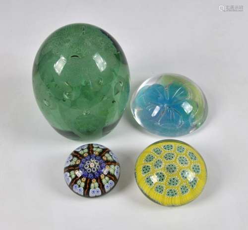 A collection of glass paperweights to include a Clichy style...