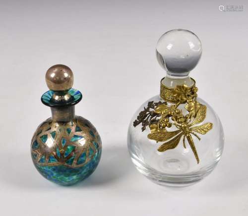 Two vintage glass scent bottles the larger of spherical clea...