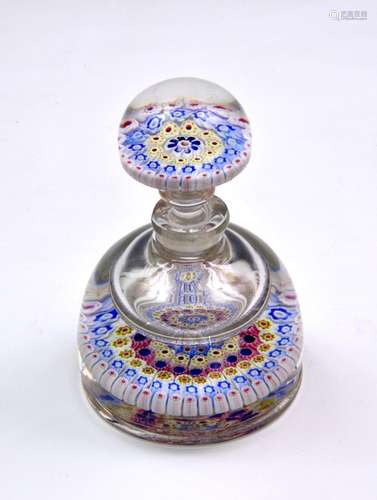 A 19th century Millefiori glass paperweight of rounded taper...