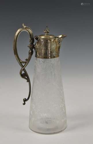 A Victorian etched glass claret jug with silver plate mounts...