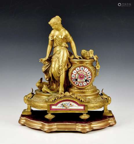 A French gilt metal and porcelain mantel clock, emblematic o...