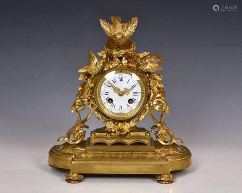 A 19th century ormolu mantel clock in the manner of Jules Mo...