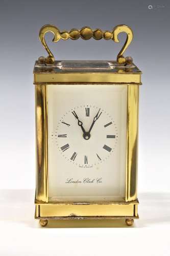 A modern single train brass carriage clock by the London Clo...