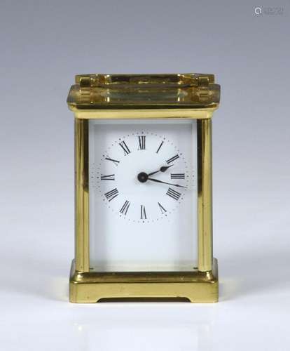 A late 19th century French brass carriage clock with leather...