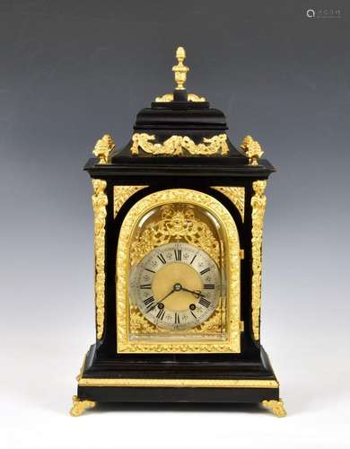 A 19th century ebonised and gilt metal mantel clock the twin...