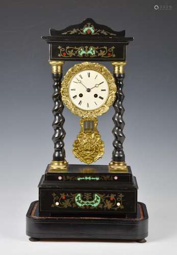 A French ebony, ebonised and inlaid portico clock