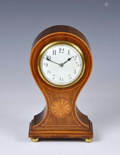 An Edwardian inlaid mahogany mantel clock