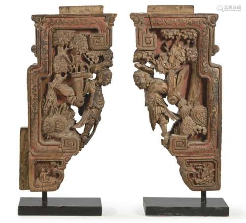 Pair of architectural fragments in carved, polychrome and gi...