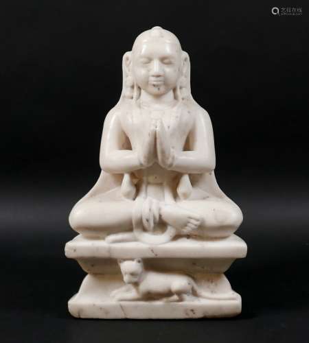 An Asian marble sculpture, modelled as the Jainist deity Mah...