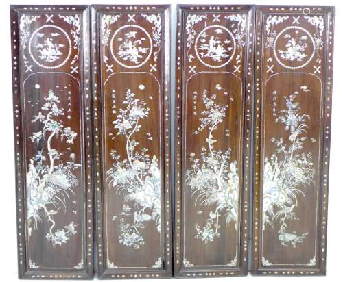 A set of four late 19th century Chinese wooden panels, inlai...
