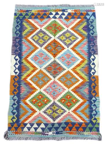 A Chobi Kilim rug, with diamond patterns to the multicolour ...