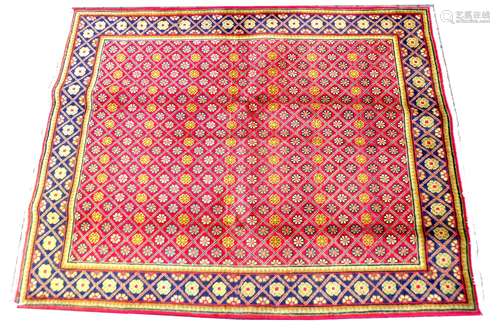 A Hamadan rug, with profuse floral design upon red ground, b...