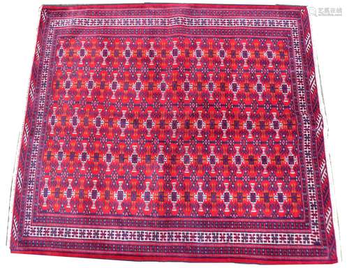 A Persian rug with red ground, 150 by 135cm.