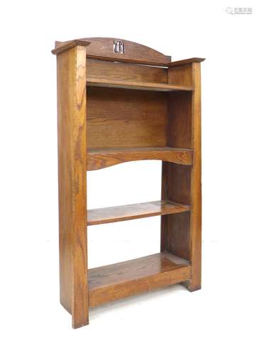 An Arts and Crafts oak bookcase, possibly by Liberty, with f...