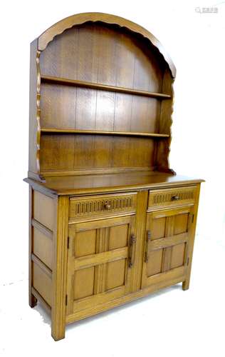 A dark stained oak Old Charm style dresser, circa 1990, with...