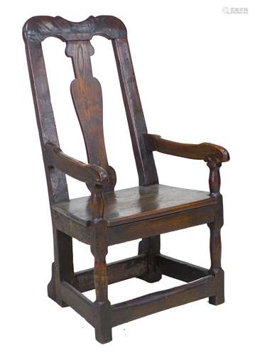 A 17th century and later oak open armchair, the high back wi...