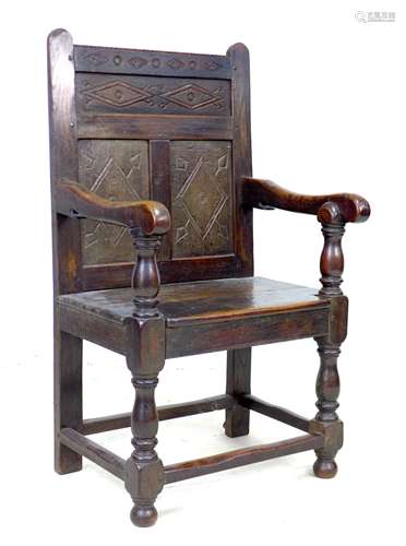 A 17th century and later oak Wainscot armchair, the solid th...