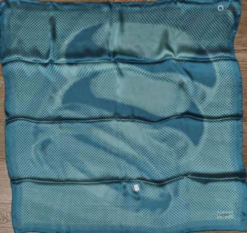 125 CARTIER : Foulard bleu turquoise à décor pointilliste, a...