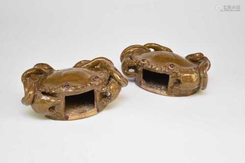 A pair of Chinese glazed stoneware crab wall pockets