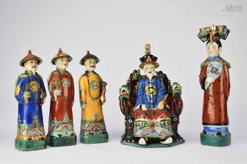 A group of five Chinese porcelain figures of an emperor and ...