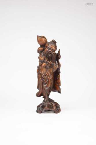 A Chinese carved wood figure of Shoulao
