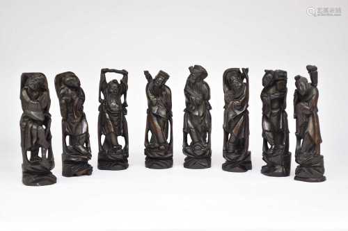 A set of Chinese carved and inlaid rosewood figures of the e...