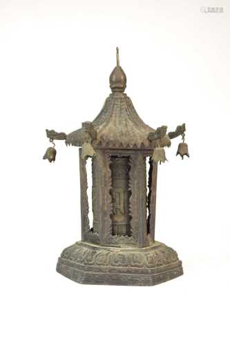 A Tibetan pressed metal prayer wheel