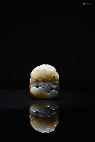 A Chinese carved pale green and russet jade pendant, Qing Dy...