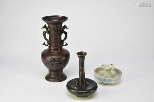 Two Japanese bronze vases and a Chinese porcelain candle hol...