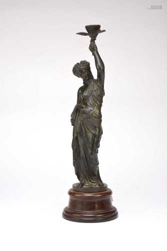 A 19th century Bronze figural candle holder