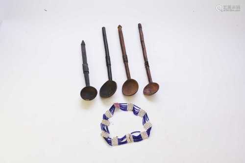 Four Zulu tribal spoons and a beadwork necklace