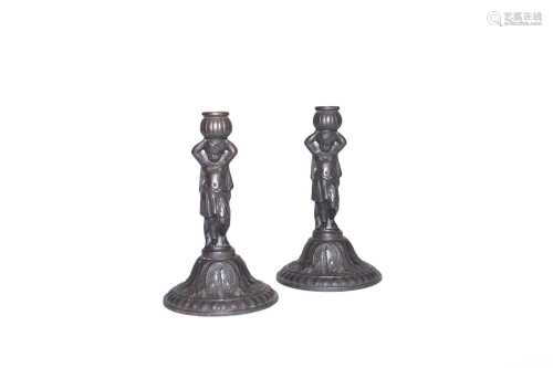 A pair of 19th century Coalbrookdale cast iron figural candl...