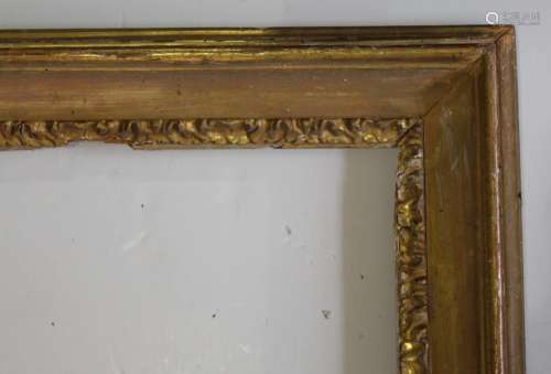 A `CARLO MARATTA` TYPE GILTWOOD PICTURE FRAME with stylised ...