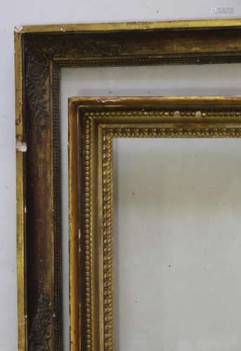 TWO GILTWOOD PICTURE FRAMES one with floral decoration to th...