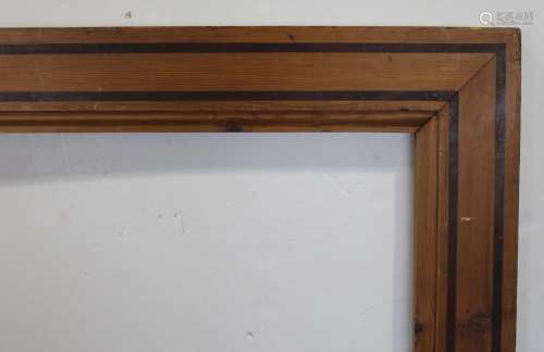 A MODERN PLAIN PINE FRAME with two darker lines of stained i...