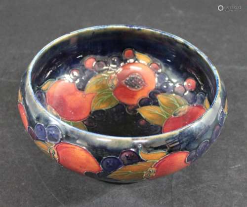 WILLIAM MOORCROFT BOWL in the Pomegranate design on a blue g...