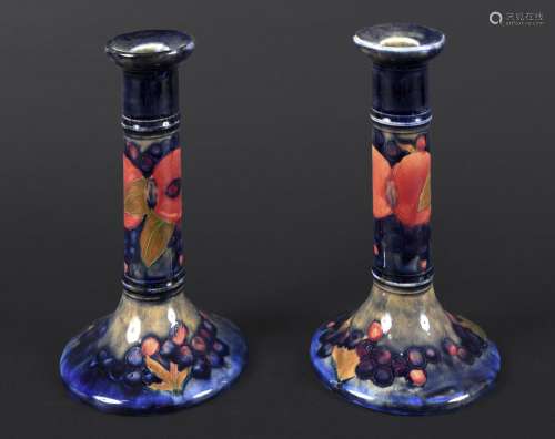PAIR OF MOORCROFT CANDLESTICKS - POMEGRANATE a pair of Willi...