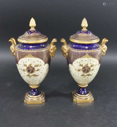 PAIR OF COALPORT LIDDED URNS a pair of lidded pedestal urns,...