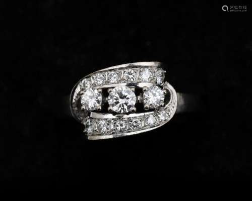 A 14 karat white gold ring, set with diamonds