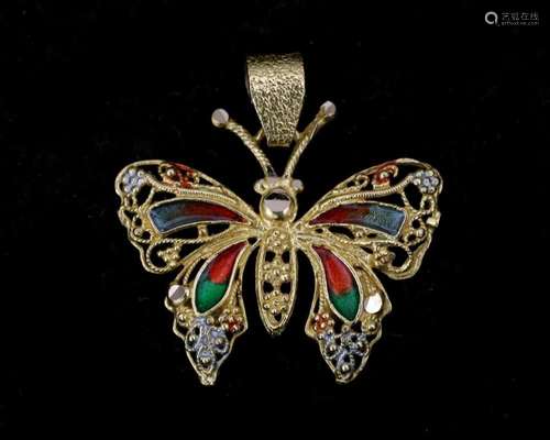 An 18 karat gold pendant in the shape of a butterfly