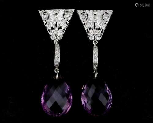 A pair of 18 karat white gold earrings set with diamonds and...