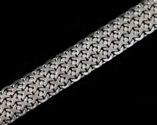 A 14 karat gold white rhodium plated braided bracelet